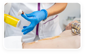 Mobile wound care nurse caring for a traumatic wound care patient.